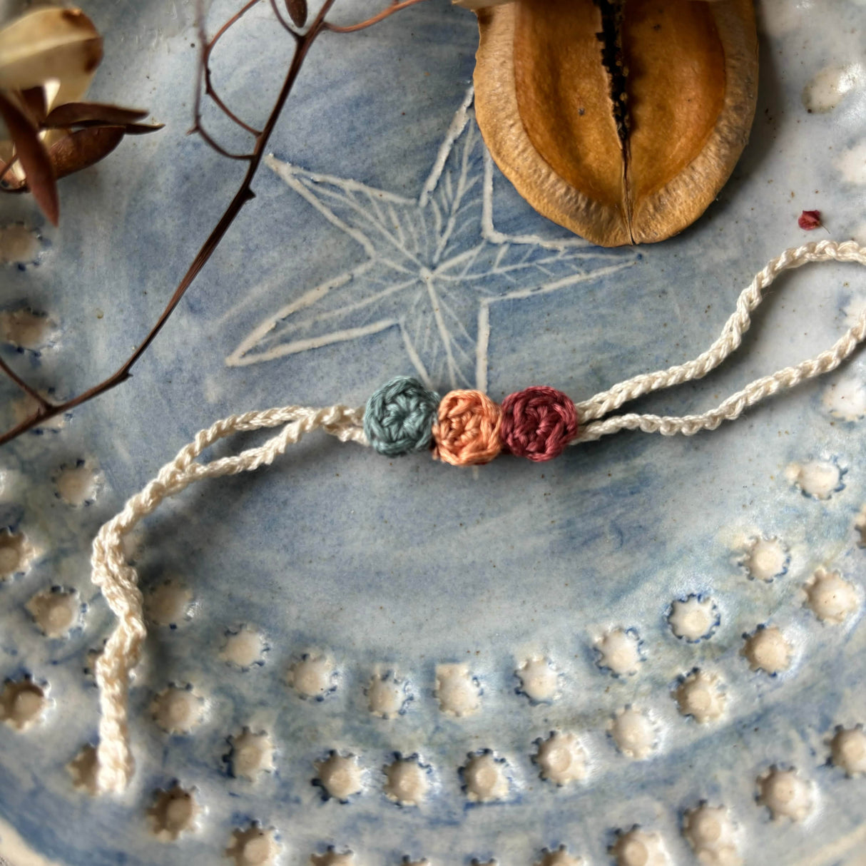Zoey Rakhi With Pouch The Sacred Knot Crochet Rakhi (First Rakshabandhan)