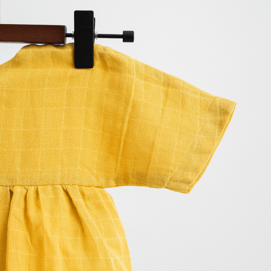 Zoey baby dress Organic Muslin Mustard Glow Dress