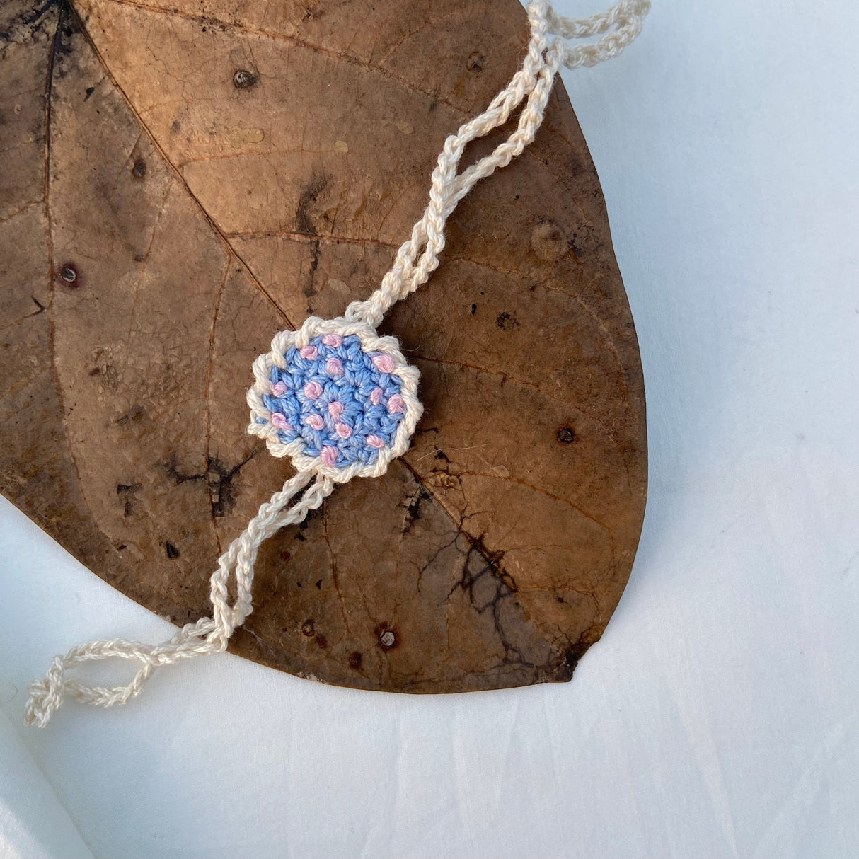 Zoey Rakhi Happiness Blooms Crochet Rakhi (First Rakshabandhan)
