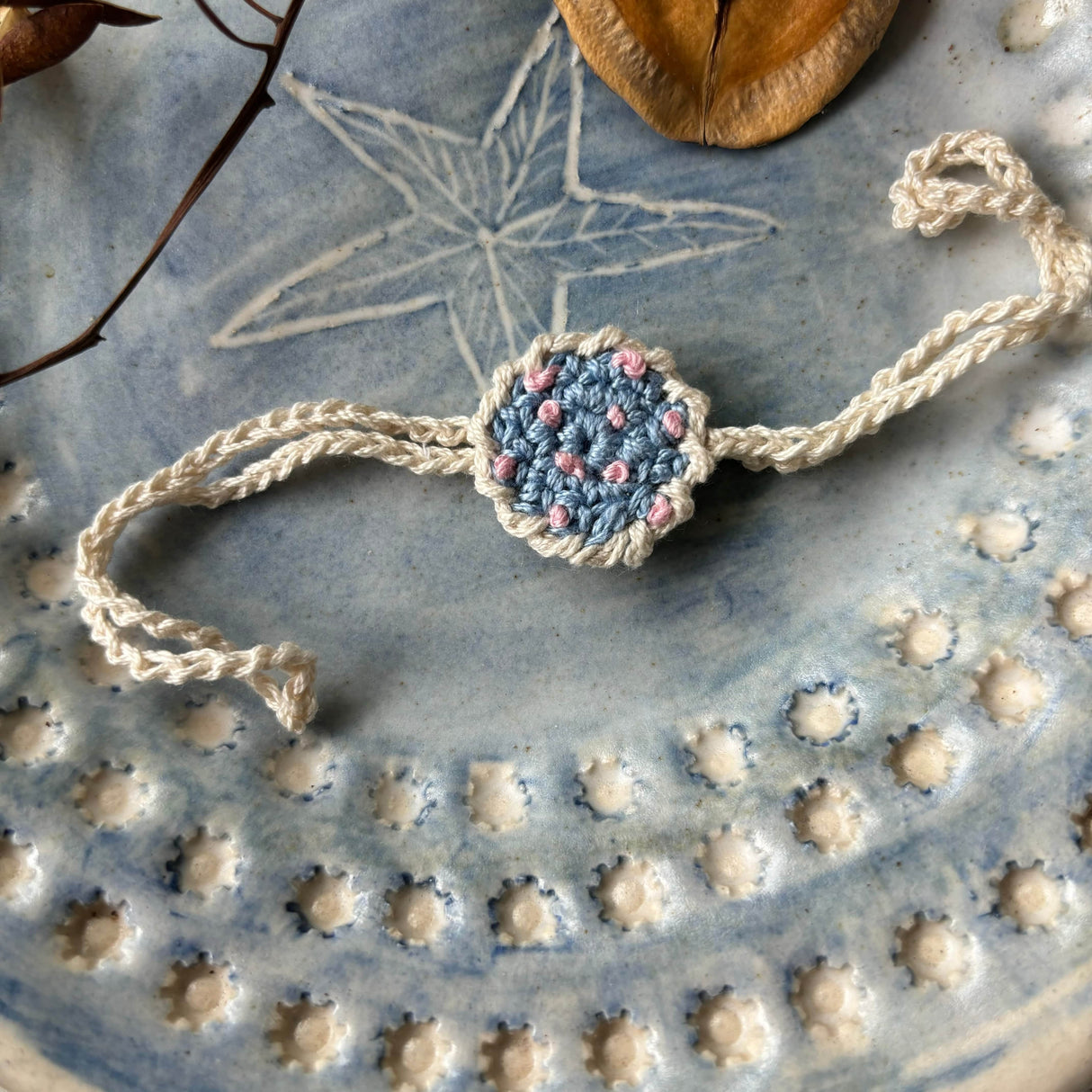 Zoey Rakhi With Embroidered Pouch Happiness Blooms Crochet Rakhi (First Rakshabandhan)