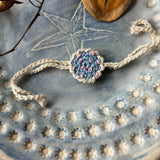 Zoey Rakhi With Embroidered Pouch Happiness Blooms Crochet Rakhi (First Rakshabandhan)