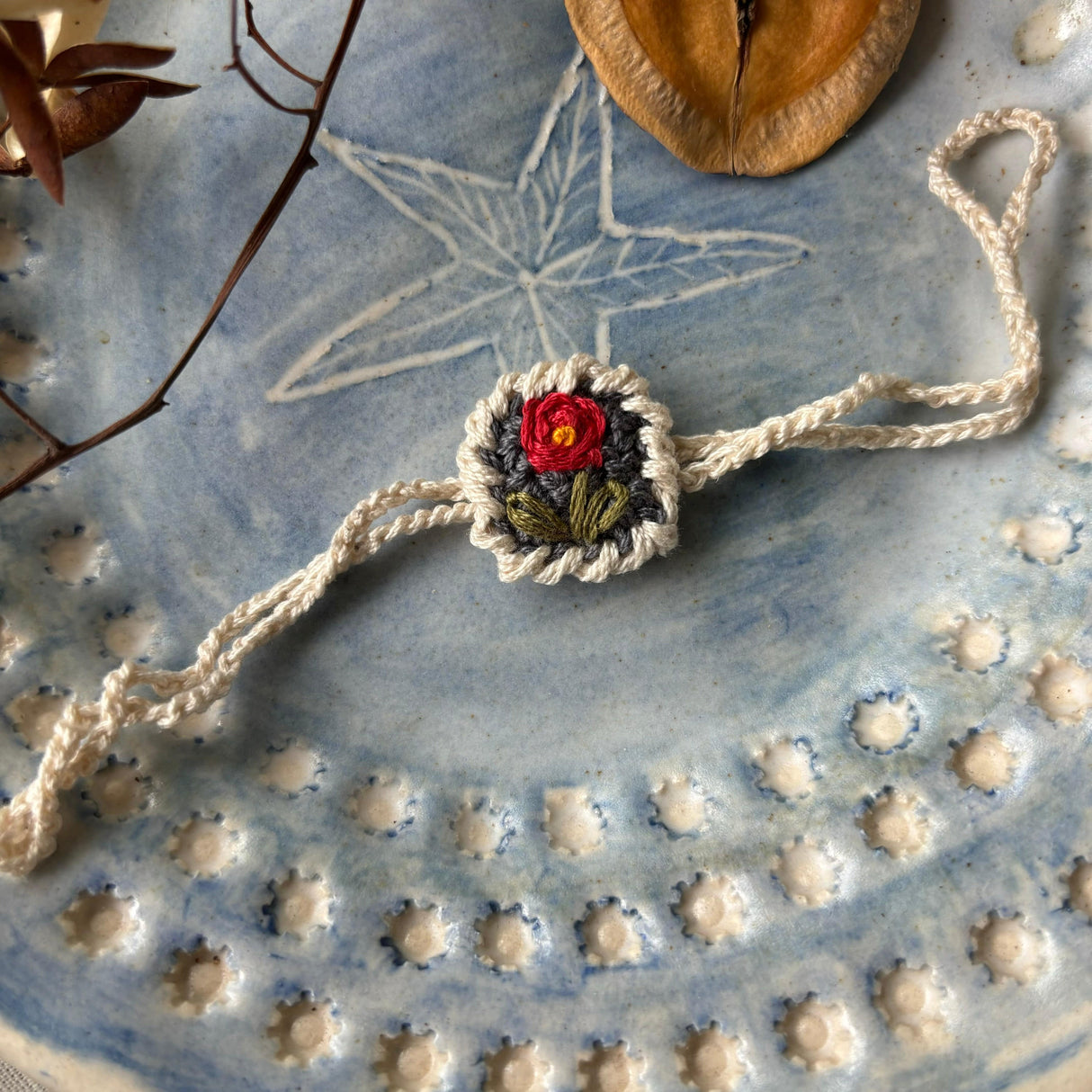 Zoey Rakhi With Embroidered Pouch My He-Rose Crochet Rakhi (First Rakshabandhan)